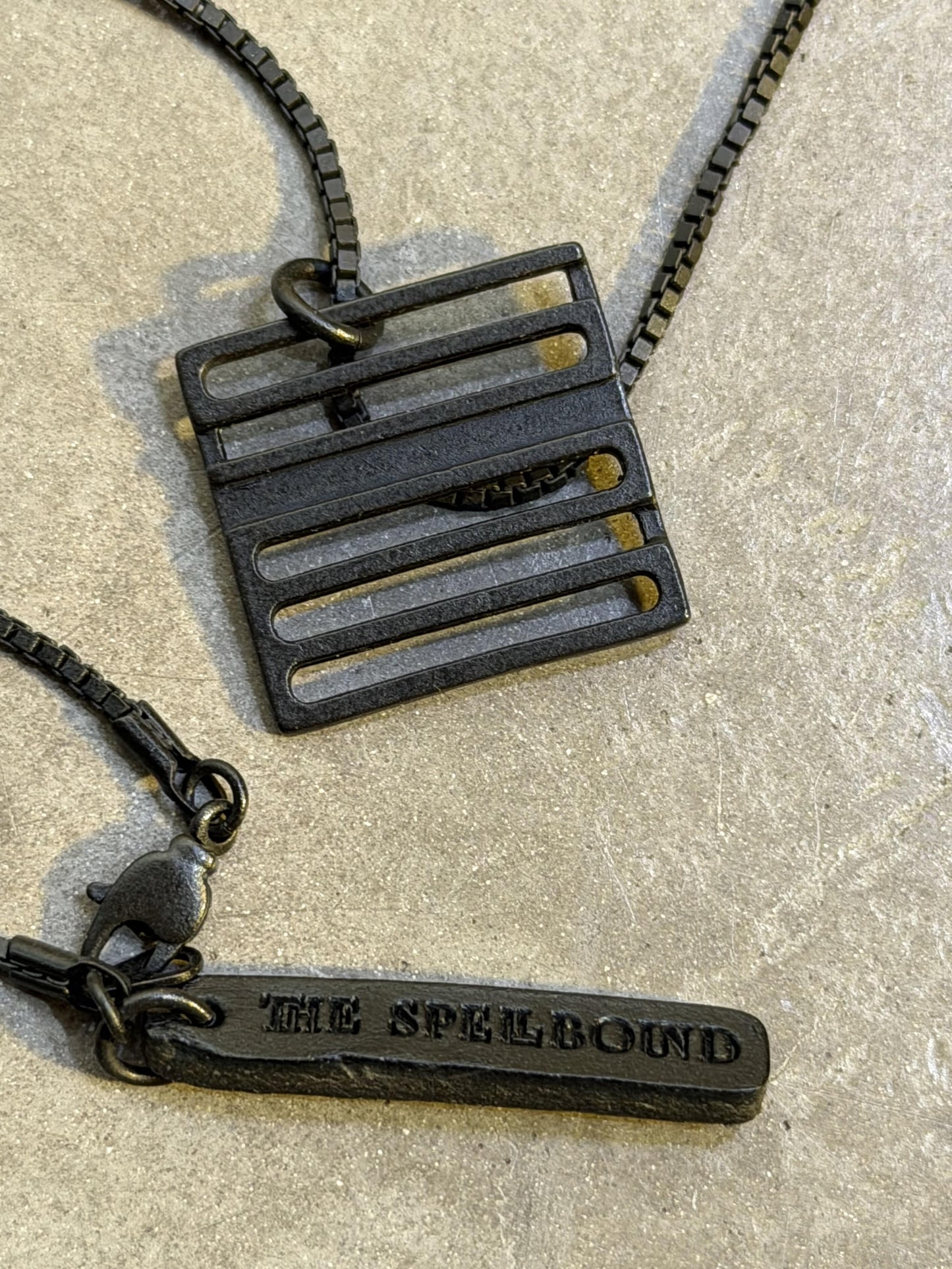 THE SPELLBOUND Metal Logo Necklace Black