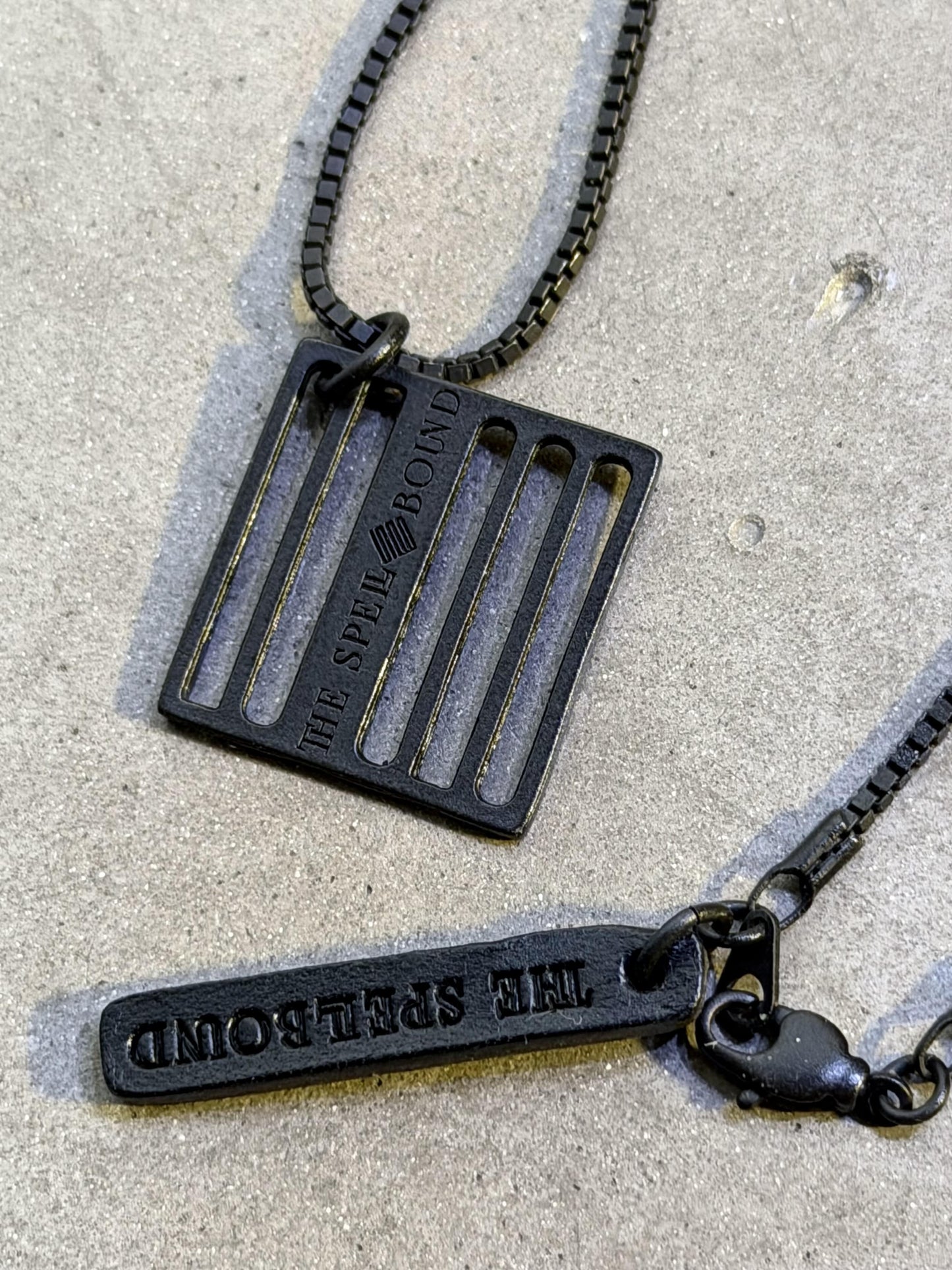 THE SPELLBOUND Metal Logo Necklace Black